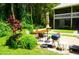 Shared patio with table, chairs, and grill at 20861 Haulover Cv # C4, Lutz, FL 33558