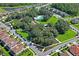 Aerial view of community park featuring green space, walking trails, and a pool at 3893 Burdick Loop, Odessa, FL 33556