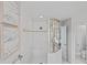 Bright bathroom features a glass enclosed shower with seating and contemporary design at 3893 Burdick Loop, Odessa, FL 33556