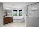 Luxurious bathroom with soaking tub, glass shower, and dual vanity sinks for spa-like relaxation at 3893 Burdick Loop, Odessa, FL 33556