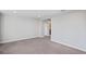 Neutral carpeted bedroom featuring a doorway and neutral paint at 3893 Burdick Loop, Odessa, FL 33556