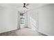 Cozy bedroom featuring a ceiling fan, a window with curtains, and a closet at 3893 Burdick Loop, Odessa, FL 33556