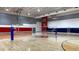 Spacious gymnasium featuring a polished hardwood floor, high ceilings, and ample natural light at 3893 Burdick Loop, Odessa, FL 33556