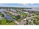 Beautiful waterfront condo community featuring lush landscaping, community pool, and water access at 8210 Aquila St # 227, Port Richey, FL 34668