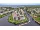 Waterfront condo community featuring boat docks, swimming pool, lush landscaping, and water views at 8210 Aquila St # 227, Port Richey, FL 34668