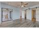 Spacious bedroom with a wood plank ceiling, barn door, and sliding doors to the screened-in lanai at 8210 Aquila St # 227, Port Richey, FL 34668