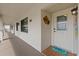 Charming condo entrance with a decorative welcome mat and updated exterior lighting at 8210 Aquila St # 227, Port Richey, FL 34668