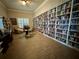 Cozy library with floor-to-ceiling bookshelves and comfortable reading areas at 8210 Aquila St # 227, Port Richey, FL 34668