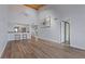 Spacious living room with wood floors, vaulted ceilings, and open floor plan to the kitchen at 8210 Aquila St # 227, Port Richey, FL 34668