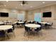Large meeting room with plenty of seating and natural light for community gatherings at 8210 Aquila St # 227, Port Richey, FL 34668