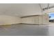Covered parking area with storage lockers and designated parking spots at 8210 Aquila St # 227, Port Richey, FL 34668