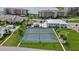 Aerial view of community tennis courts, putting green, pool and common area at 8210 Aquila St # 227, Port Richey, FL 34668