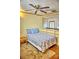 Bedroom with built-in shelves and wood floors at 20890 Negril Ct # R3, Lutz, FL 33558