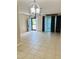Living room with tile flooring, light fixture and access to Florida Room at 8141 Bugle Ct # 1, Port Richey, FL 34668