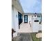 Front entrance of the home with a walkway and landscaping at 8141 Bugle Ct # 1, Port Richey, FL 34668
