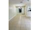 Bright dining room with tile flooring and a light fixture at 8141 Bugle Ct # 1, Port Richey, FL 34668