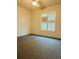 Bright bedroom with carpeted floor and window shutters at 8141 Bugle Ct # 1, Port Richey, FL 34668