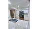 Modern kitchen with a breakfast bar and stainless steel appliances at 8141 Bugle Ct # 1, Port Richey, FL 34668