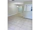 Dining area with tile floors and a modern light fixture at 8141 Bugle Ct # 1, Port Richey, FL 34668