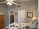 Bright main bedroom with a ceiling fan, dresser, and large closet at 21146 Fountain View Ln # 4302, Lutz, FL 33558