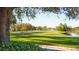 Landscaped golf course with trees, pond, and a golfer at 4309 Hunters Pass, Spring Hill, FL 34609