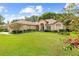 Well-maintained house with a lush lawn and landscaping at 4309 Hunters Pass, Spring Hill, FL 34609