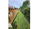 Landscaped backyard with deck and grass at 7720 Chapel Ave, Port Richey, FL 34668