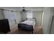 Serene bedroom with ceiling fan and ample closet space at 3814 Holiday Lake Dr, Holiday, FL 34691