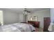 Bright bedroom with ceiling fan, dresser and closet at 3814 Holiday Lake Dr, Holiday, FL 34691