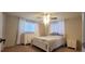Bright bedroom featuring a queen bed and plenty of storage at 3814 Holiday Lake Dr, Holiday, FL 34691