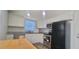 Updated kitchen with stainless steel appliances and granite countertops at 3814 Holiday Lake Dr, Holiday, FL 34691