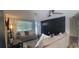 Spacious living room featuring a dark accent wall and ample natural light at 3814 Holiday Lake Dr, Holiday, FL 34691