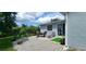 Private patio with brick pavers and lush landscaping at 3814 Holiday Lake Dr, Holiday, FL 34691