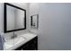 Modern bathroom boasts a sleek vanity with granite countertop and undermount sink at 6635 Stewart N Ave, St Petersburg, FL 33702