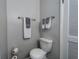 Cozy bathroom with toilet, modern fixtures and towel bars at 6635 Stewart N Ave, St Petersburg, FL 33702