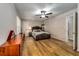Spacious bedroom with hardwood floors, ceiling fan, and neutral paint at 6635 Stewart N Ave, St Petersburg, FL 33702