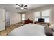 Bright bedroom features two windows, hardwood flooring, and closet at 6635 Stewart N Ave, St Petersburg, FL 33702