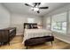 Well-lit bedroom showcases a large window, wood floors, and a comfy bed at 6635 Stewart N Ave, St Petersburg, FL 33702