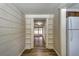 Hallway with view to kitchen and living room featuring beautiful wood floors at 6635 Stewart N Ave, St Petersburg, FL 33702