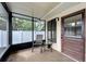 Cozy screened porch with seating, offering a relaxing outdoor space at 6635 Stewart N Ave, St Petersburg, FL 33702