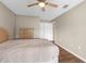 Spacious bedroom with wood-look floors and ample closet space at 8175 Sturbridge Ct # 0, Weeki Wachee, FL 34613