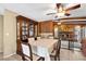 Dining room with stone fireplace and wood dining set at 7504 Cypress Knee Dr, Hudson, FL 34667