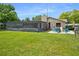 Screened pool and patio area with fire pit and seating at 7504 Cypress Knee Dr, Hudson, FL 34667