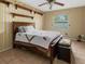 Bedroom with a queen-size bed and built-in shelves at 7504 Cypress Knee Dr, Hudson, FL 34667