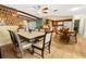 Bright dining area with a wood table and chairs, adjacent to the kitchen at 7504 Cypress Knee Dr, Hudson, FL 34667