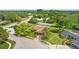 Aerial view of a home nestled in a green neighborhood at 7504 Cypress Knee Dr, Hudson, FL 34667