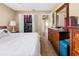 Bedroom with large bed, dresser, and walk-in closet at 7504 Cypress Knee Dr, Hudson, FL 34667