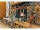 Cozy stone fireplace with a rustic mantel and decorative accents at 7504 Cypress Knee Dr, Hudson, FL 34667