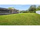 Spacious backyard with large grassy area at 7504 Cypress Knee Dr, Hudson, FL 34667