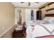 Bedroom with queen bed, access to hallway, and large closet at 7504 Cypress Knee Dr, Hudson, FL 34667